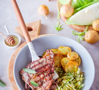 Juicy pork neck in caramelised cabbage