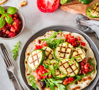 Podpłomyk flat bread with grilled courgettes and tomato salsa